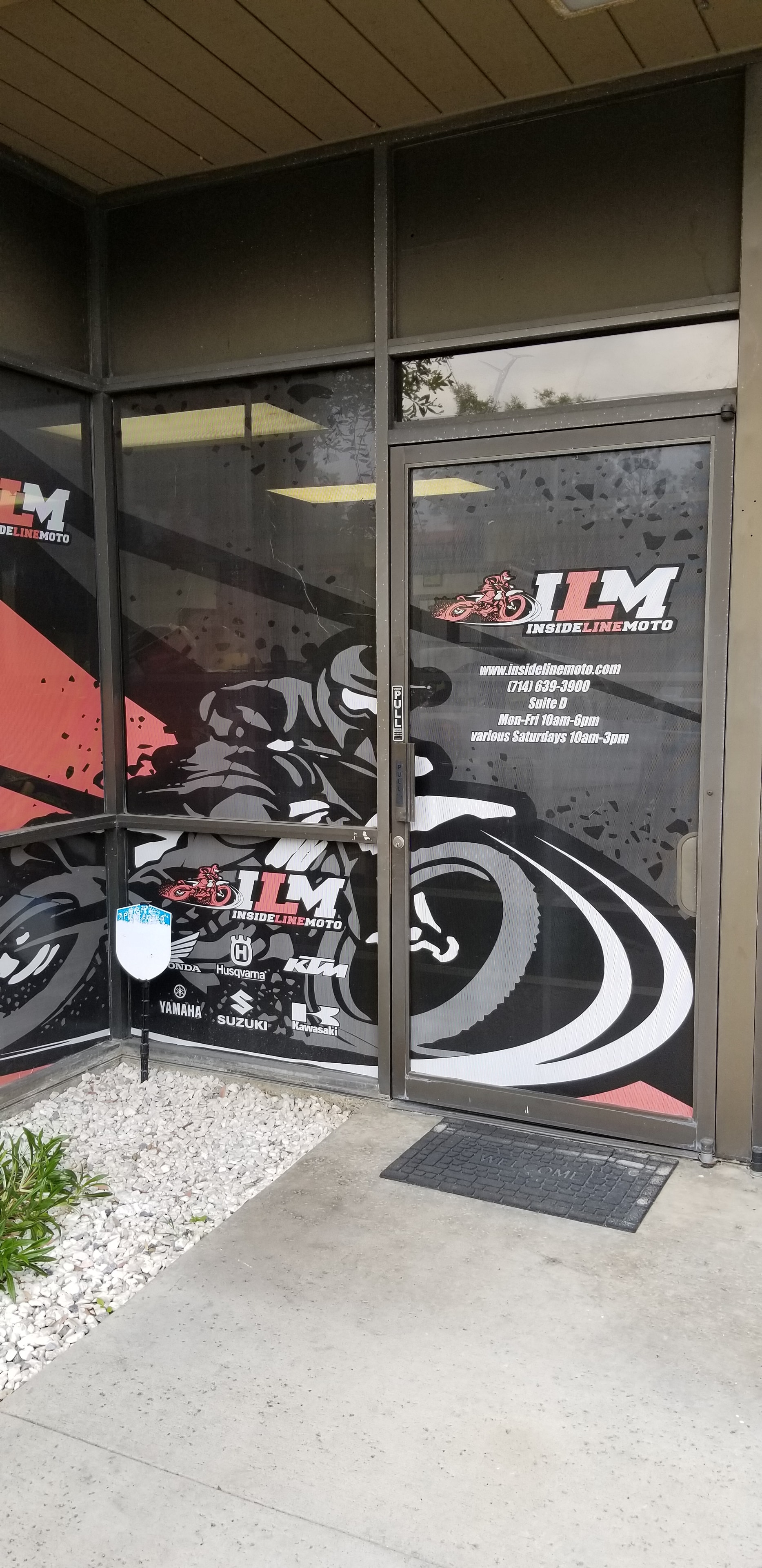 ILM storefront window graphics with brand logos