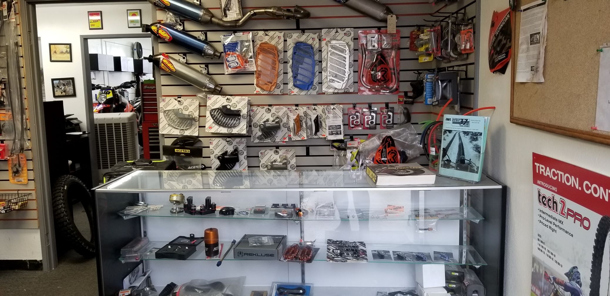 ILM parts counter with exhausts, guards, and accessories